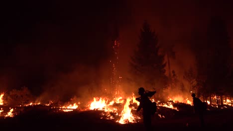 Exhausted-Firefighters-Work-Hard-At-Night-To-Contain-The-Disastrous-Dixie-Fire-In-Northern-California