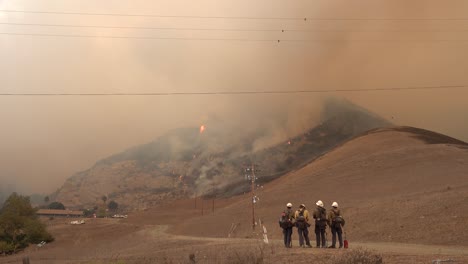 The-Alisal-Fire-Burns-On-A-Hillside-Along-The-Gaviota-Coast-As-Firefighters-Look-On-In-Santa-Barbara-County