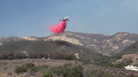 A-Large-Air-Tanker-Aircraft-Makes-A-Dramatic-Drop-Of-Phos-Chek-Fire-Retardant-On-A-Mountainside-During-The-Alisal-Fire-Along-The-Gaviota-Coast-In-Santa-Barbara-County