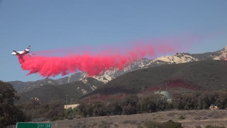 A-Large-Air-Tanker-Aircraft-Makes-A-Dramatic-Drop-Of-Phos-Chek-Fire-Retardant-On-A-Mountainside-During-The-Alisal-Fire-Along-The-Gaviota-Coast-In-Santa-Barbara-County