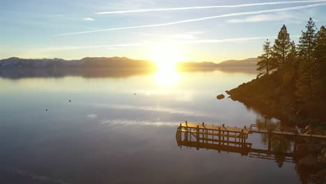 Evening-Sunset-Drone-Aerial-Over-Glenbrook,-Lake-Tahoe,-Nevada,-Past-A-Beautiful-Pier-In-The-Water-On-The-Lake
