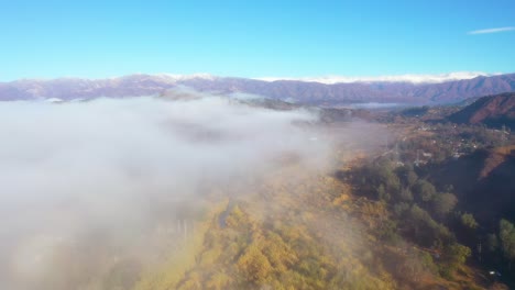 Aerial-Over-Clouds-And-Fog-Reveals-The-Ojai-Valley-And-Snow-Covered-Topatopa-Mountains-In-Winter
