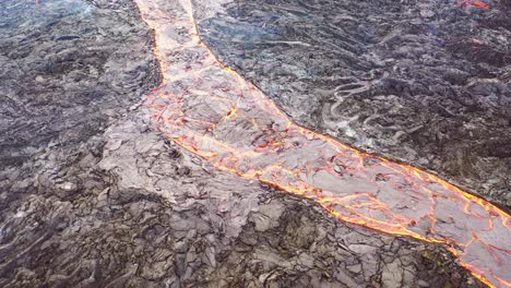 Aerial-View-Of-Hot-Lava-Flowing-In-A-Volcanic-River-Near-The-Fagradalsfjall-Volcano-On-The-Reykjanes-Peninsula-In-Iceland