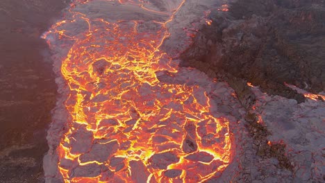 Top-Down-High-Angle-Drone-Aerial-Of-Molten-Lava-Fields-And-Snow-Falling-At-The-Fagradalsfjall-Volcano-Eruption-In-Iceland