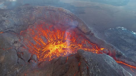 Amazing-Night-Drone-Aerial-High-View-Of-Active-Volcano-Crater-Fagradalsfjall-Volcano-With-Lava-Boulders-Falling-In-In-Iceland
