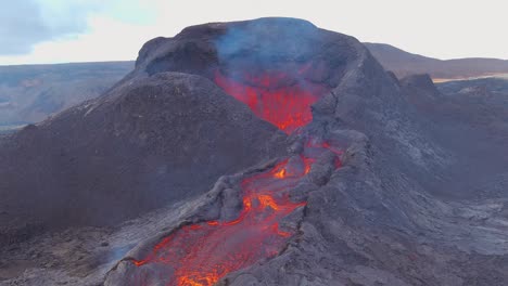 Slow-Tilt-Down-Of-Lava-Flowing-From-The-Crater-At-The-Fagradalsfjall-Volcano-Volcanic-Explosive-Eruption-In-Iceland