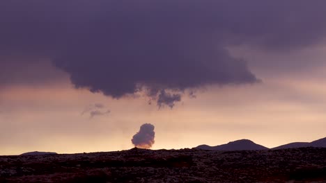 The-Fagradalsfjall-Volcano-Is-Seen-Erupting-In-The-Distance-In-A-Cloud-Of-Smoke-And-Ash