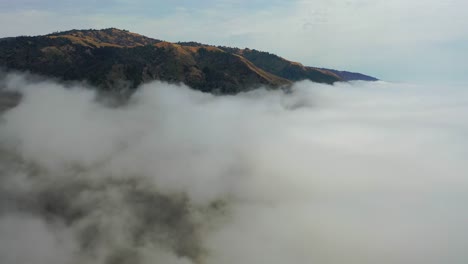 Beautiful-Aerial-Shot-Through-The-Fog-Reveals-The-Remote-Mountains-Along-California'S-Highway-One-Pacific-Coast-Highway-Near-Big-Sur