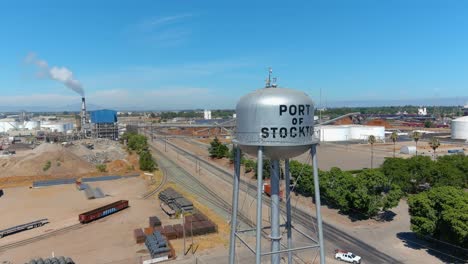 Establishing-Aerial-Of-Port-Of-Stockton-Industrial-Area-With-Trucks-And-Smokestacks