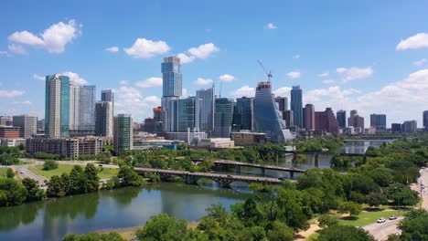 Beautiful-Aerial-Over-The-Colorado-River-In-Downtown-Austin,-Texas-With-Skyline-Background