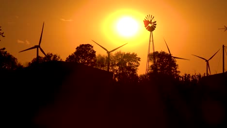 Sehr-Gute-Aufnahme-Kontrastiert-Moderne-Windkraft-Mit-Traditioneller-Windmühle-Bei-Sonnenaufgang-Oder-Sonnenuntergang