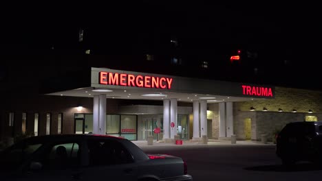 Good-Night-Establishing-Shot-Of-A-Generic-Modern-Hospital-With-Emergency-Room-And-Trauma-Center