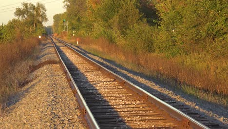 Empty-Railroad-Tracks-Stretch-Into-The-Distance-And-The-Signal-Light-Is-Green