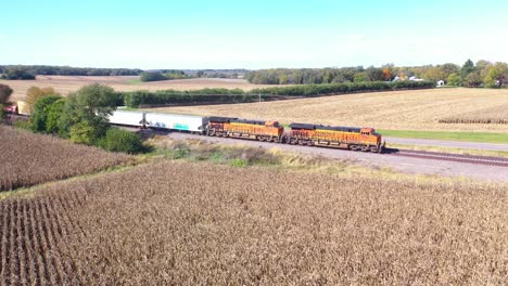 Aerial-Of-A-Freight-Train-Passing-Through-Cornfields-In-The-Midwest