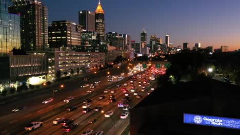 Beautiful-Rising-Aerial-Shot-Of-Atlanta,-Georgia-Freeway-And-Downtown-Skyline-At-Dusk,-Sunset-Or-Night