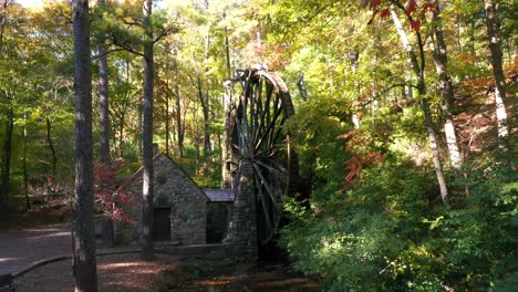 Beautiful-Aerial-Of-Waterwheel-At-An-Old-Mill-In-The-Forest-In-Rome,-Georgia