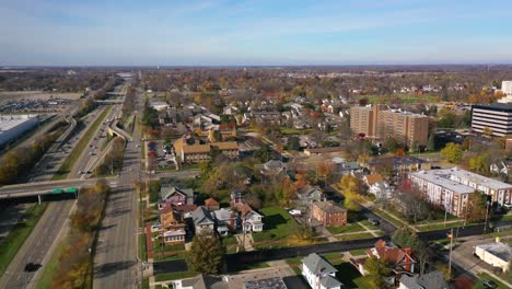 Good-Aerial-Over-East-Lansing,-Michigan,-Suburbs,-Freeway,-Highway