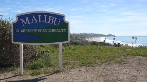 A-Sign-Welcomes-Visitors-To-Malibu,-California-With-21-Miles-Of-Scenic-Beauty