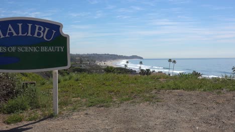 A-Sign-Welcomes-Visitors-To-Malibu,-California-With-21-Miles-Of-Scenic-Beauty