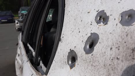Cars-Are-Riddled-With-Bullet-Holes-Along-A-Street-In-Irpin-Ukraine-During-The-Russian-Occupation
