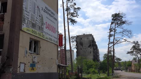 A-Devastated-Neighborhood-Of-Irpin,-Kiev,-Where-A-Real-Estate-Billboard-Advertises-A-Better-Future