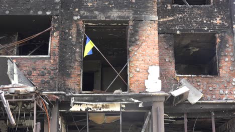 Remarkable-Shot-Of-Ukrainian-Flag-In-Burned-Window-Sill-Of-Destroyed-Apartment-Complex-In-Irpin-Kyiv-Ukraine