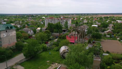 Aerial-Of-Makariv,-Ukraine-Bombed-And-Rocketed-Apartment-Buildings-And-Destroyed-Water-Tank-During-Russian-Invasion-And-Occupation