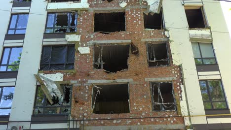 Tilt-Down-Of-A-Damaged-Building-In-Bucha,-Ukraine-Following-The-Russian-Invasion-And-Occupation