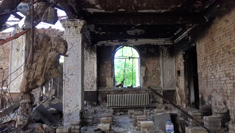 The-Devastated-Interior-And-Collapsed-Roof-Of-The-Bucha-Concert-Music-Hall-In-Bucha,-Ukraine-Following-The-Russian-Invasion