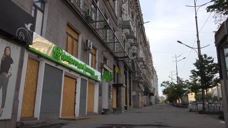 The-Streets-Of-Central-Downtown-Kharkiv-Are-Abandoned,-Businesses-Boarded-Up-And-Destroyed,-During-Russian-Invasion,-Shelling-And-Bombing-Attacks