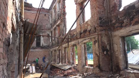 Workmen-Conduct-Cleanup-Operations-In-A-School-Building-Which-Has-Been-Destroyed-By-A-Russian-Rocket-Attack-In-Saltivka,-Kharkiv,-Ukraine