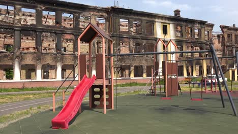A-Badly-Damaged-School-Building-With-Children'S-Playground-Foreground-In-Saltivka,-Kharkiv,-Ukraine