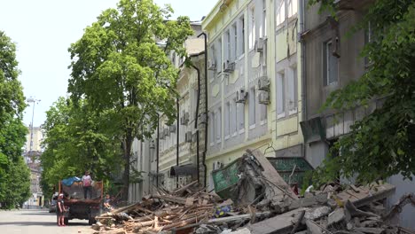 Rubble-Is-Cleaned-Up-By-Work-Crews-In-Central-Kharkiv,-Ukraine-As-A-Result-Of-Intense-Russian-Rocket-Attacks-During-The-Russian-Invasion