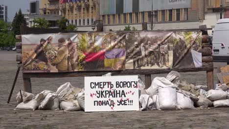 A-Handmade-Sign-In-Kharkiv-Central-Square-And-Administration-District-Reads-""Death-To-The-Enemy,-Ukraine-Above-All""