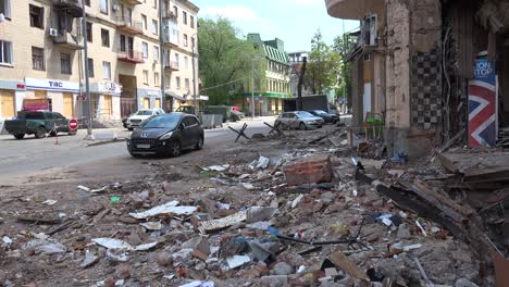 A-Bomb-Crater-Has-Destroyed-A-Building-In-Central-Kharkiv-And-Graffiti-Reads-""Time-Hears-It""