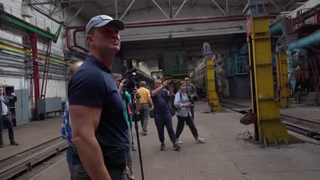 Ukrainian-Celebrity-Chef-Nikolay-Tischenko-Walks-Through-A-Railway-Maintenance-Facility-Is-Destroyed-By-Russian-Rockets-In-Kyiv,-Ukraine
