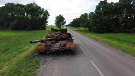 Rising-Aerial-Over-Destroyed-And-Abandoned-Russian-Tank-Left-Along-A-Road-During-Ukraine'S-Summer-Offensive