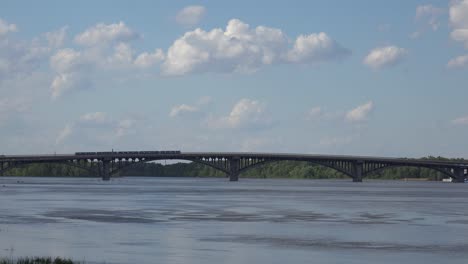 Establishing-Shot-Of-The-Mist-Metro-Bridge-Over-The-Dnipro-River-In-Kyiv,-Kiev,-Ukraine