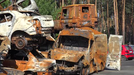 Stacked-And-Destroyed-Cars-Are-Riddled-With-Bullet-Holes-Along-A-Street-In-Irpin-Ukraine-During-The-Russian-Occupation