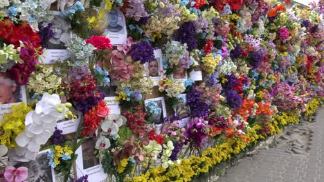 A-Large-Flowered-Memory-Wall-Of-Fallen-Female-Ukrainian-War-Heroes-Killed-By-Russian-Aggression-Along-A-Main-Street-In-Lviv,-Ukraine