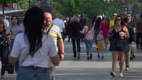 Large-Crowds-Of-Ukrainians-Walk-On-The-Street-In-Central-Lviv,-Ukraine