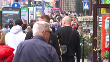 Large-Crowds-Of-Ukrainians-Walk-On-The-Street-In-Central-Lviv,-Ukraine