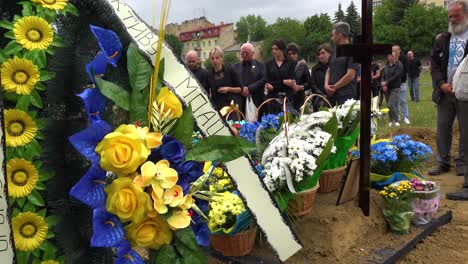 A-Large-Family-Gathering-For-The-Burial-At-The-Gravesite-Of-A-Fallen-Ukrainian-Soldier-In-Lviv,-During-The-War-In-Ukraine