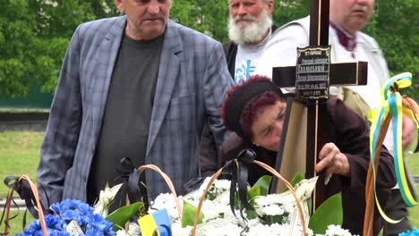 A-Ukrainian-Mother-Or-Grandmother-Says-Farewell-To-Her-Son-At-A-Soldier-Funeral-During-The-War-In-Ukraine