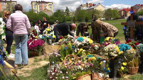 A-Large-Family-Gathering-For-The-Burial-At-The-Gravesite-Of-A-Fallen-Ukrainian-Soldier-In-Lviv,-During-The-War-In-Ukraine