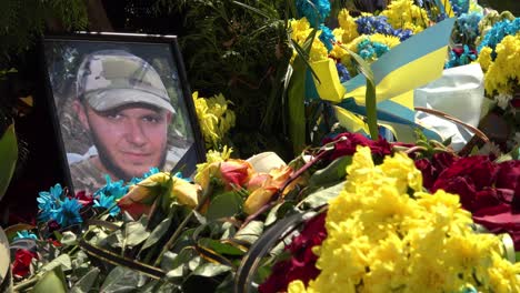 The-Photo-Of-A-Young-Soldier-Atop-A-Grave-Serves-As-A-Poignant-Reminder-Of-The-Tragedy-Of-The-War-In-Ukraine