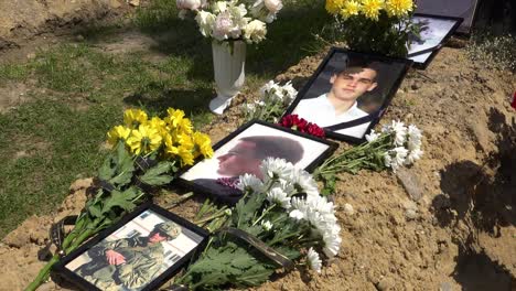 The-Freshly-Dug-Grave-Of-A-Handsome-Young-Ukrainain-Soldier-Shows-Beautiful-Photos-Of-Him-When-Alive