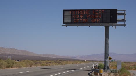 A-Highway-Sign-Warns-Of-Extreme-Heat-And-To-Save-Water-During-Severe-Drought-In-California