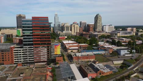 Good-Aerial-Of-Raleigh-North-Carolina-Downtown-Skyline-Passing-Office-Tower