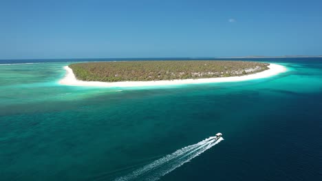 Excellent-Aerial-Shot-Of-A-Small-Boat-Approaching-The-Rote-Islands-Of-Indonesia